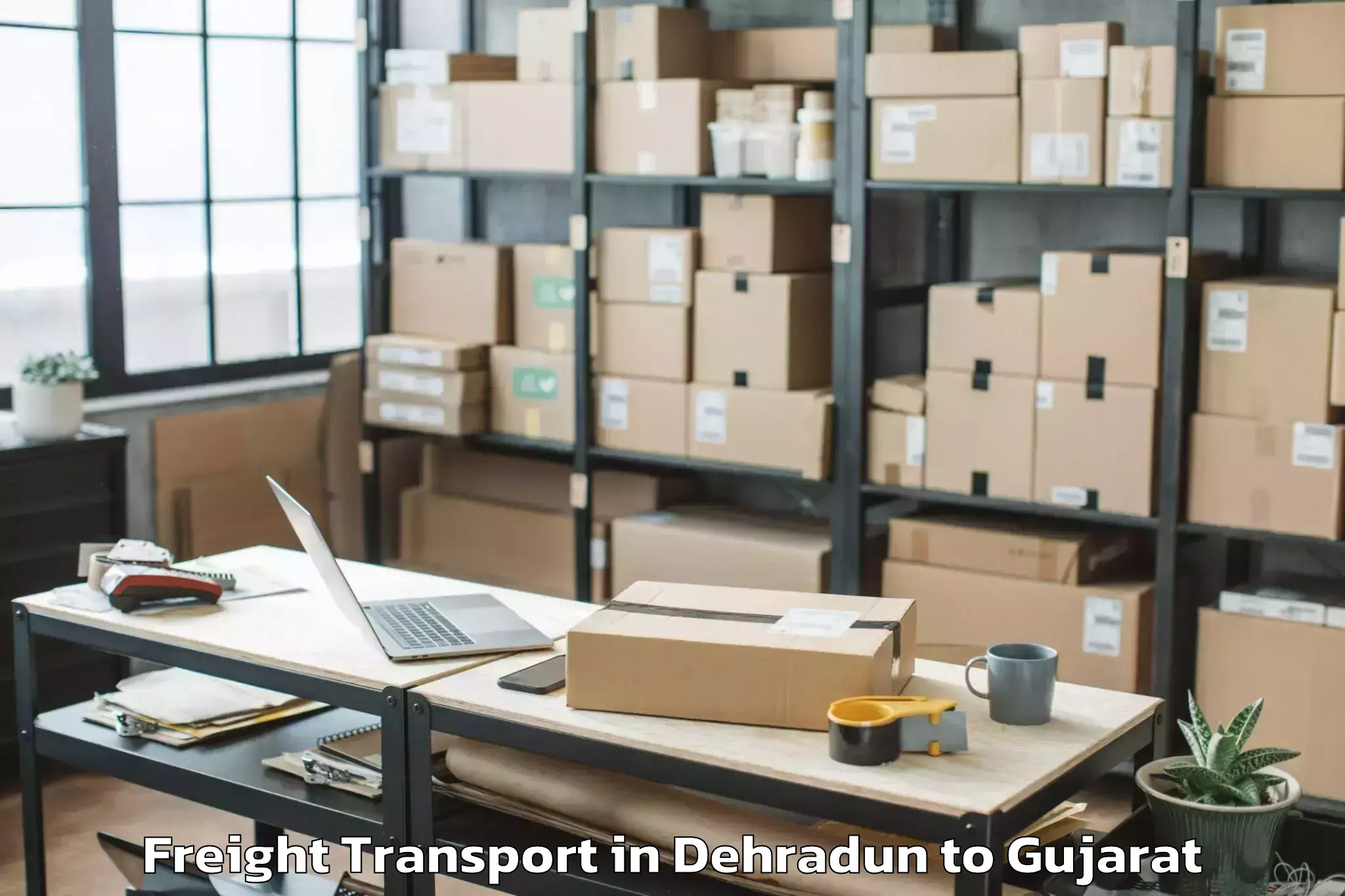 Book Your Dehradun to Mendarda Freight Transport Today